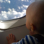 Baby Looking Through Aeroplane Window
